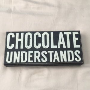 “Chocolate understands” sign